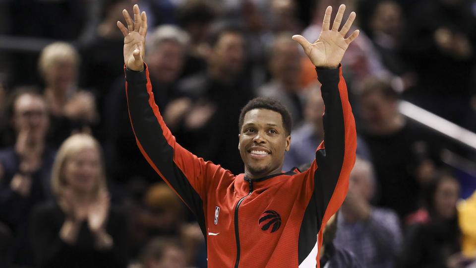 Former Toronto Raptors guard Kyle Lowry (7) acknowledges the crowd before a game. (Richard Lautens/Toronto Star via Getty Images)