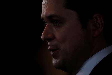 FILE PHOTO: Conservative leader Andrew Scheer speaks to the media following the tabling of the budget in the House of Commons on Parliament Hill in Ottawa, Ontario, Canada, February 27, 2018. REUTERS/Blair Gable/File Photo