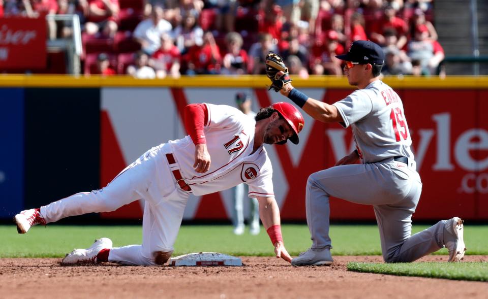 Apr 23, 2022; Cincinnati, Ohio, USA; Cincinnati Reds shortstop Kyle Farmer (17) is caught out stealing second base against St. Louis Cardinals second baseman Tommy Edman (19) during the second inning at Great American Ball Park. Mandatory Credit: David Kohl-USA TODAY Sports