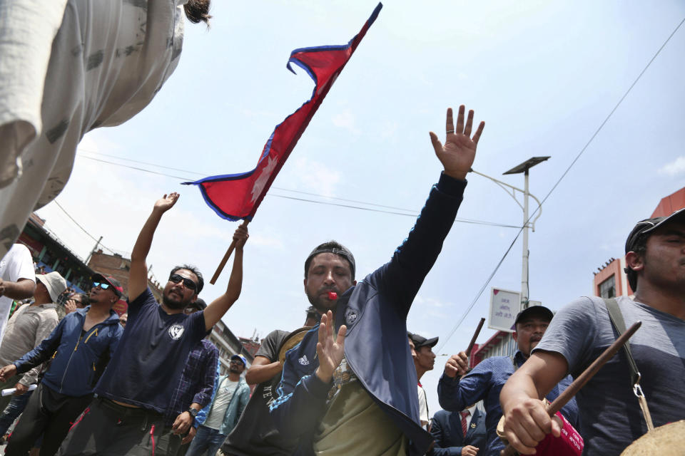 Nepalese Newar community members shout slogans during a protest against government in Kathmandu, Nepal, Wednesday, June 19, 2019. Thousands of people protested in the Nepalese capital to protest a Bill that would give government control over community and religious trusts. Protesters demanded the government scrap the proposed Bill to protect these trusts that hold religious ceremonies and festivals. (AP Photo/Niranjan Shrestha)