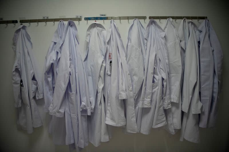 The nurses' uniforms hang on the wall of finished but still unused building A2 of the Shanghai Public Clinical Center, following the outbreak of the new coronavirus, in Shanghai