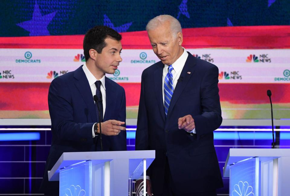 Former Vice President Joseph Biden, right, and Mayor of South Bend, Indiana Pete Buttigieg talk before the second Democratic primary debate in Miami on June 27, 2019.