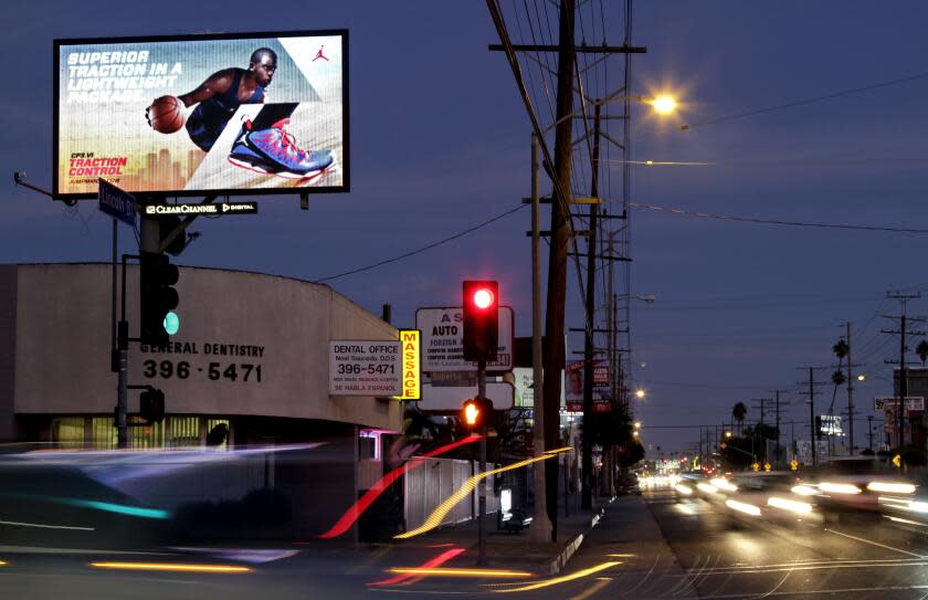 DeAratanha, Ricardo –– B582447290Z.1 VENICE, CA – OCTOBER 15, 2012 – Digital billboard on Lincoln Blvd. at Superba Ave. in Venice, October 15, 2012. Mindy Taylor–Ross, who lives a block from it complains that it shines through her bathroom window to her bedroom. The Los Angeles City Council is poised to begin a series of secret meetings with outdoor advertising companies, spurring fears in neighborhoods that a deal is afoot to increase the number of digital billboards around the city. (Ricardo DeAratanha/Los Angeles Times).