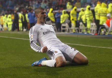 Alvaro Morata celebrates his goal against Rayo Vallecano during their Spanish First Division soccer match at Santiago Bernabeu stadium in Madrid March 29, 2014. REUTERS/Andrea Comas