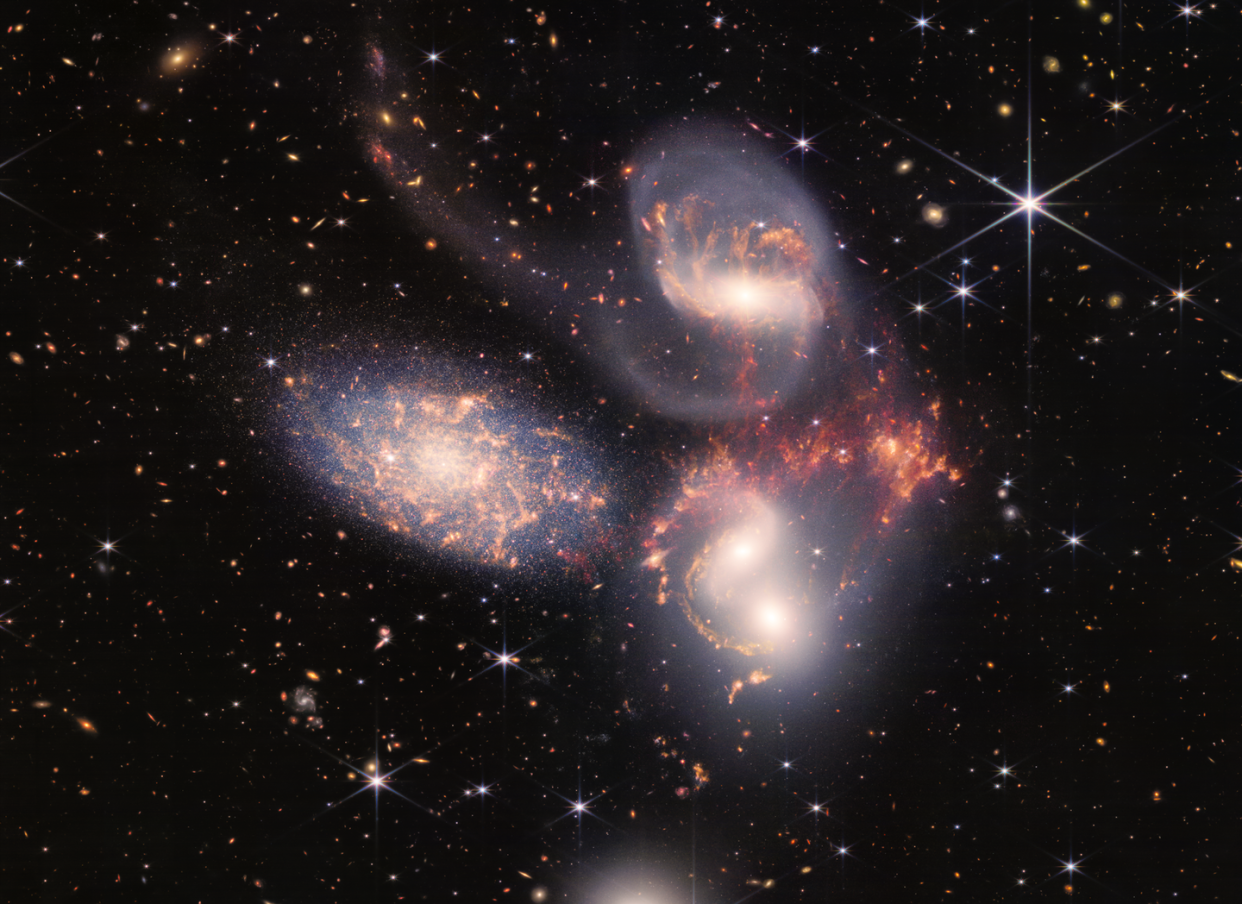 <span>This cluster of galaxies, called Stephan's Quintet, is a composite image produced from two cameras aboard the James Webb Space Telescope.</span> <span><a href="https://webbtelescope.org/contents/media/images/2022/034/01G7DA5ADA2WDSK1JJPQ0PTG4A?news=true" rel="nofollow noopener" target="_blank" data-ylk="slk:NASA/STScI;elm:context_link;itc:0;sec:content-canvas" class="link ">NASA/STScI</a></span>