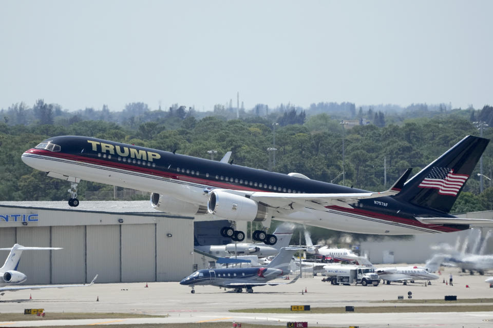 The plane carrying former president Donald Trump lifts off at Palm Beach International Airport, Monday, April 3, 2023, in West Palm Beach, Fla. Trump is heading to New York for his expected booking and arraignment on charges arising from hush money payments during his 2016 campaign.(AP Photo/Rebecca Blackwell)