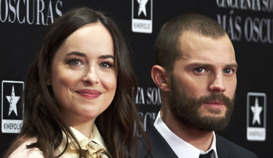 Dakota Johnson shares how she got through her sex scenes with Jamie Dornan.