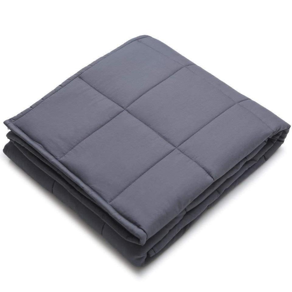 <p>This <span>YnM Weighted Blanket</span> ($40, originally $80) will keep you warm and comforted. It's the perfect thing to grab for a movie marathon.</p>