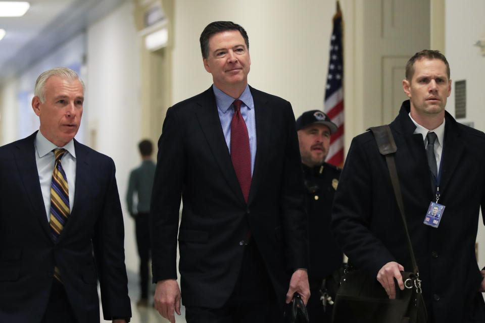 Former FBI Director James Comey and his attorney, David Kelley, left, arrive to testify under subpoena behind closed doors on Capitol Hill in Washington Friday. (Photo: Manuel Balce Ceneta/AP)