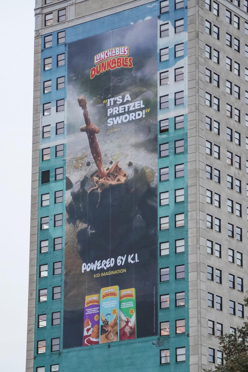 An advertisement for Lunchables covers the 1997 Robert Wyland whale on the side of the Broderick Tower in downtown Detroit on Tuesday, Oct. 10, 2023.