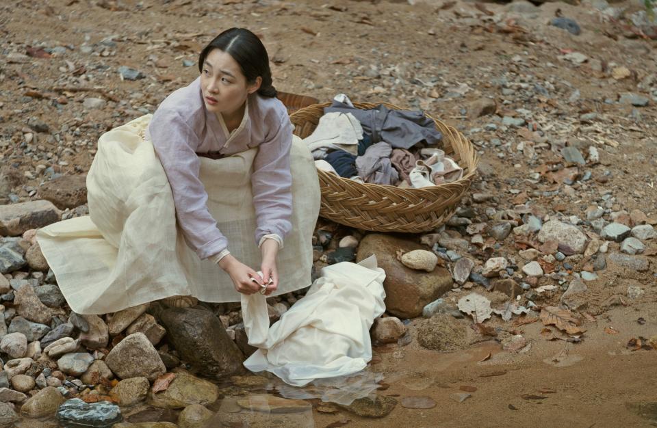 Kim Min-ha does laundry in a river