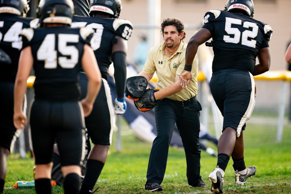 Buchholz Bobcats head coach Chuck Bell participates in a drill before the game against the Eastside Rams at Citizens Field in Gainesville, FL on Friday, September 8, 2023. [Matt Pendleton/Gainesville Sun]