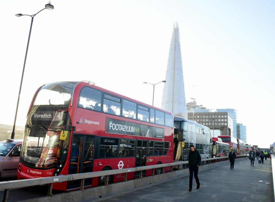 Buses on London Bridge in London (Ian West/PA) (PA Archive)