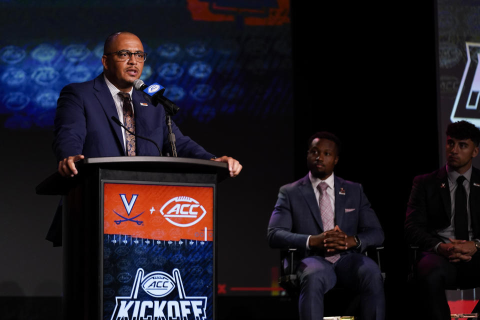 Virginia head coach Tony Elliott speaks during the Atlantic Coast Conference NCAA college football media days Wednesday, July 26, 2023, in Charlotte, N.C. (AP Photo/Erik Verduzco)