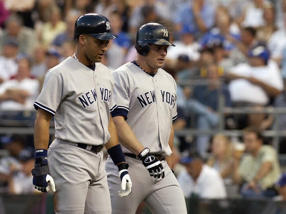 Derek Jeter (left) and Yankees teammate Jason Giambi.