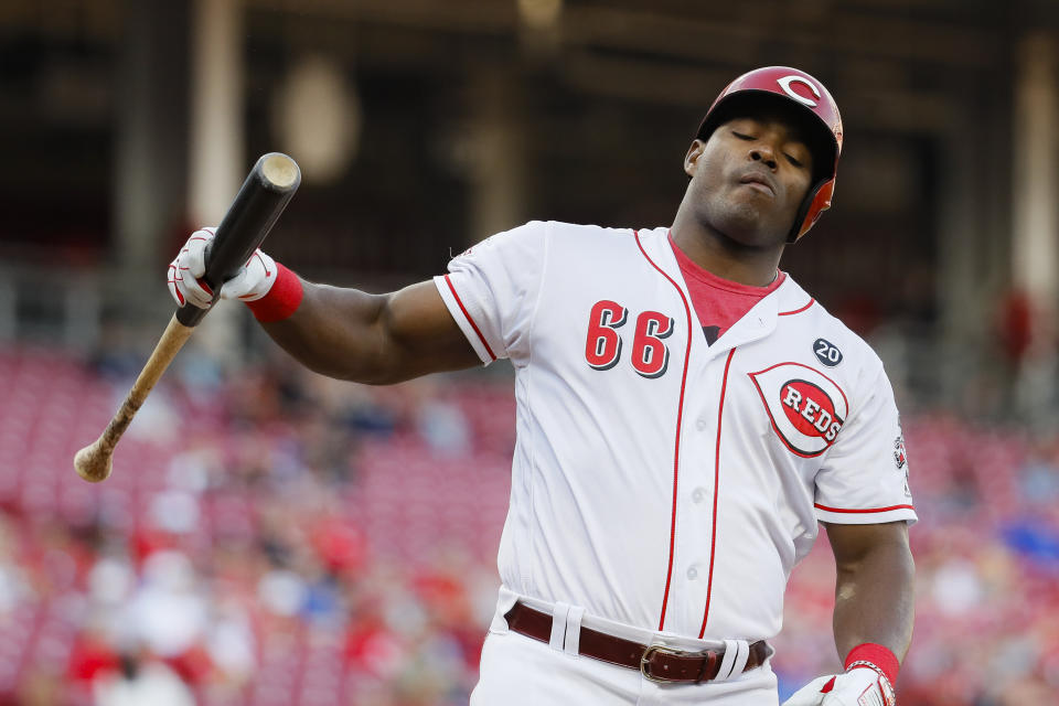 Cincinnati Reds' Yasiel Puig reacts after striking out against Chicago Cubs starting pitcher Kyle Hendricks during the second inning of a baseball game Tuesday, May 14, 2019, in Cincinnati. (AP Photo/John Minchillo)
