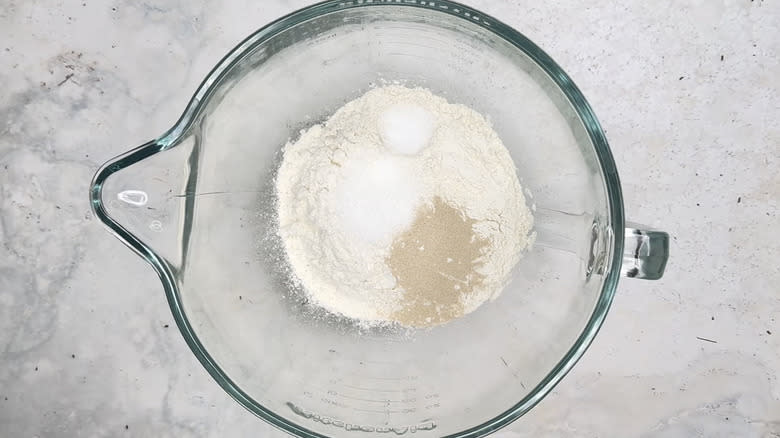 flour, sugar, yeast, and salt in mixing bowl