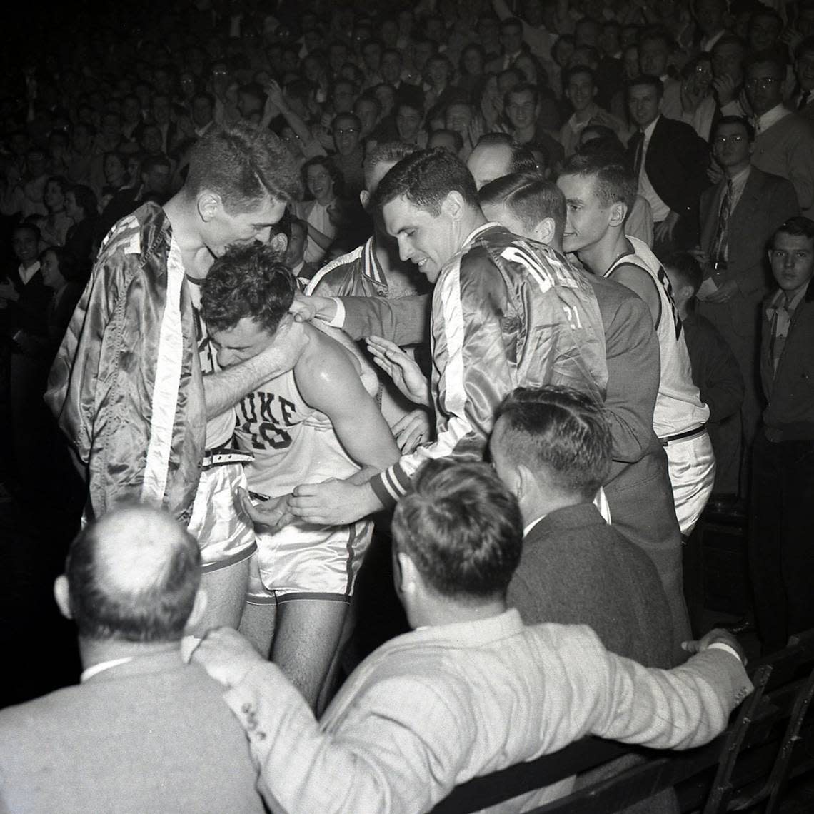 Dick Groat receives congratulations after breaking Duke’s scoring record by scoring 48 points against North Carolina on Feb. 29, 1952. File photo