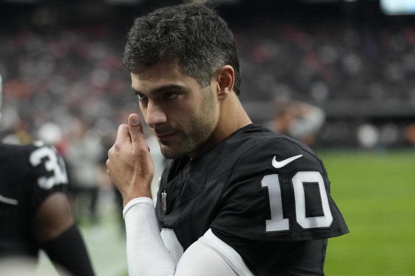 Las Vegas Raiders quarterback Jimmy Garoppolo (10) warms up before a game against the Denver Broncos.