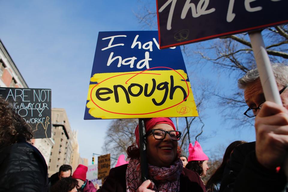 A woman holds a poster as she attends the second annual National Womens March on January 20, 2018 in New York City.