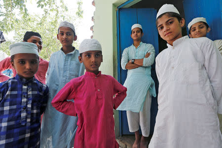 FILE PHOTO: Muslim boys stand during a break inside a madrasa or religious school in the village Nayabans in the northern state of Uttar Pradesh, India May 9, 2019. REUTERS/Adnan Abidi