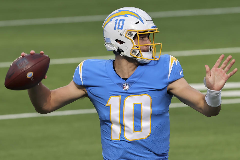 Justin Herbert set the NFL rookie record for touchdown passes in his 14th game. (Sean M. Haffey/Getty Images)