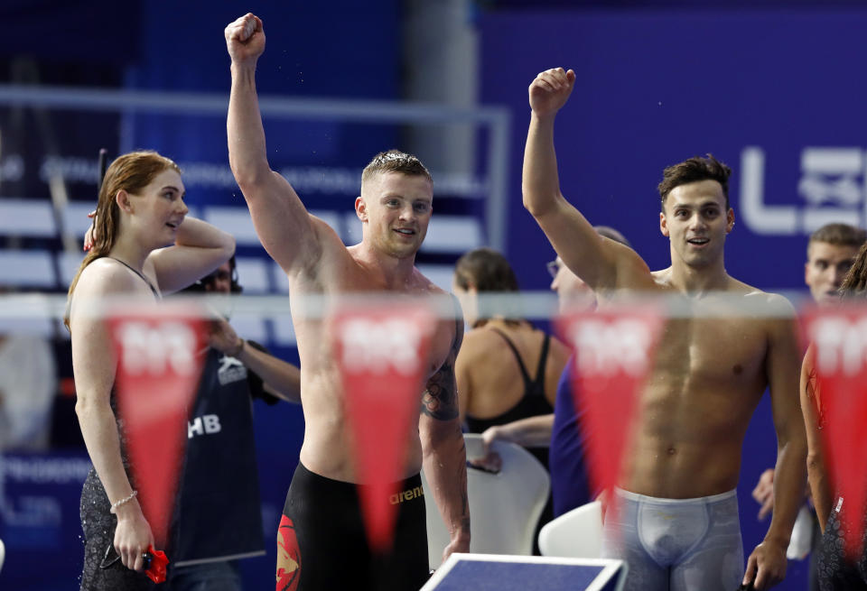 Freya Anderson, Adam Peaty and James Guy, from left to right, of Great Britain, react after winning the 4 X 100 meters medley relay mixed final at the European Swimming Championships in Glasgow, Scotland, Monday, Aug. 6, 2018. (AP Photo/Darko Bandic)