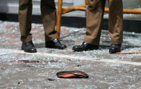 A shoe of a victim is seen in front of the St. Anthony's Shrine, Kochchikade church after an explosion in Colombo, Sri Lanka April 21, 2019. REUTERS/Dinuka Liyanawatte/Files