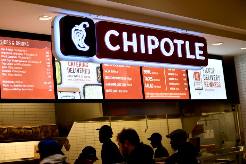 FILE PHOTO: Customers order from a Chipotle restaurant as holiday shopping accelerates at the King of Prussia Mall