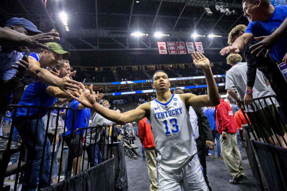Kentucky's Jemarl Baker Jr. (13) is greeted by fans as he leaves the court after defeating Wofford in a second-round game in the NCAA men’s college basketball tournament in Jacksonville, Fla., Saturday, March 23, 2019. (AP Photo/Stephen B. Morton)