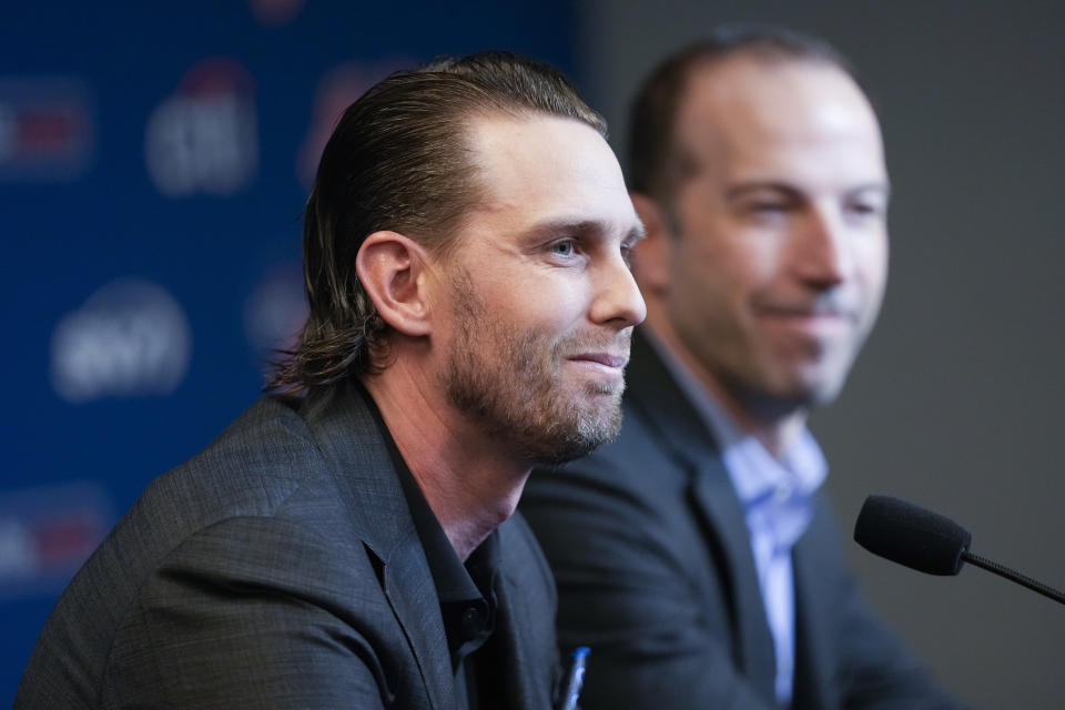 New York Mets' Jeff McNeil, left, and general manager Billy Eppler speak to reporters during a news conference, Tuesday, Jan. 31, 2023, in New York. Batting champion Jeff McNeil and the New York Mets finalized a $50 million, four-year contract Tuesday that avoided a salary arbitration hearing.(AP Photo/Mary Altaffer)