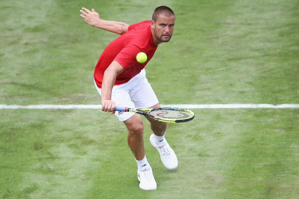 Mikhail Youzhny of Russia takes a volley.