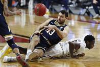 Notre Dame's Nikola Djogo (13) falls on Boston College's Jay Heath (5) during the second half of an NCAA college basketball game, Saturday, Feb. 27, 2021, in Boston. (AP Photo/Michael Dwyer)