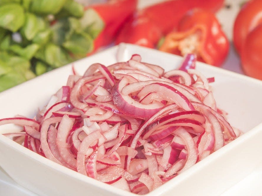 pickled red onion in a bowl