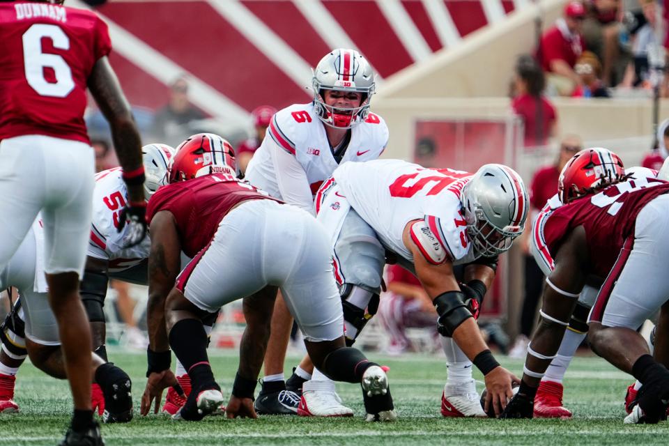 Ohio State quarterback Kyle McCord lines up behind offensive lineman Carson Hinzman. McCord played eight of the Buckeyes 10 series against Indiana.