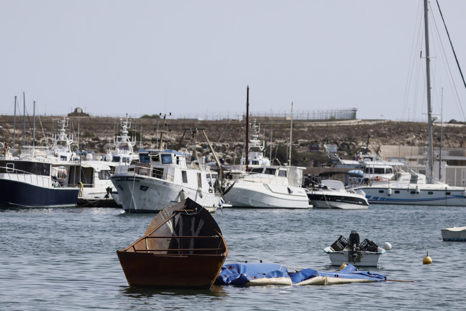The remains of boats which were used to carry migrants are seen in the port of the Sicilian island of Lampedusa, southern Italy, Monday, Sept. 18, 2023. The Italian Cabinet met Monday to adopt new measures to crack down on migration after the southern island of Lampedusa was again overwhelmed by a wave of arrivals from Tunisia and the migration issue again took center stage in Europe with talk of a naval blockade. (Cecilia Fabiano/LaPresse via AP)