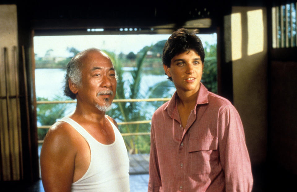 Pat Morita and Ralph Macchio in a scene from the film 'The Karate Kid', 1984. (Photo by Columbia Pictures/Getty Images)