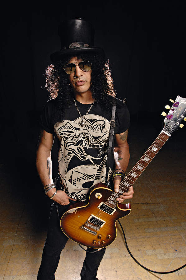 Slash holding a Les Paul guitar