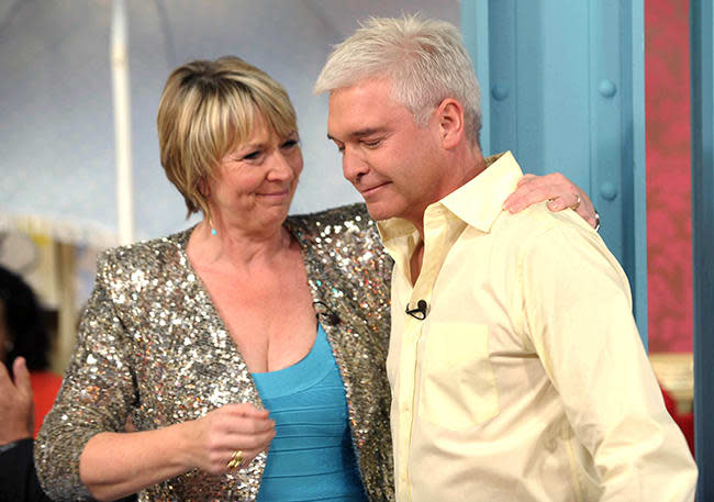 Fern Britton comforts Phillip Schofield on her last show in 2009