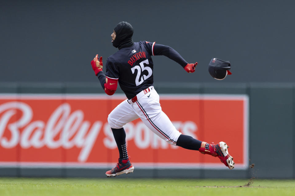Minnesota Twins Byron Buxton (25) loses his helmet while running to second base after hitting a double during the second inning of a baseball game against the Detroit Tigers, Saturday, April 20, 2024, in Minneapolis. (AP Photo/Stacy Bengs)