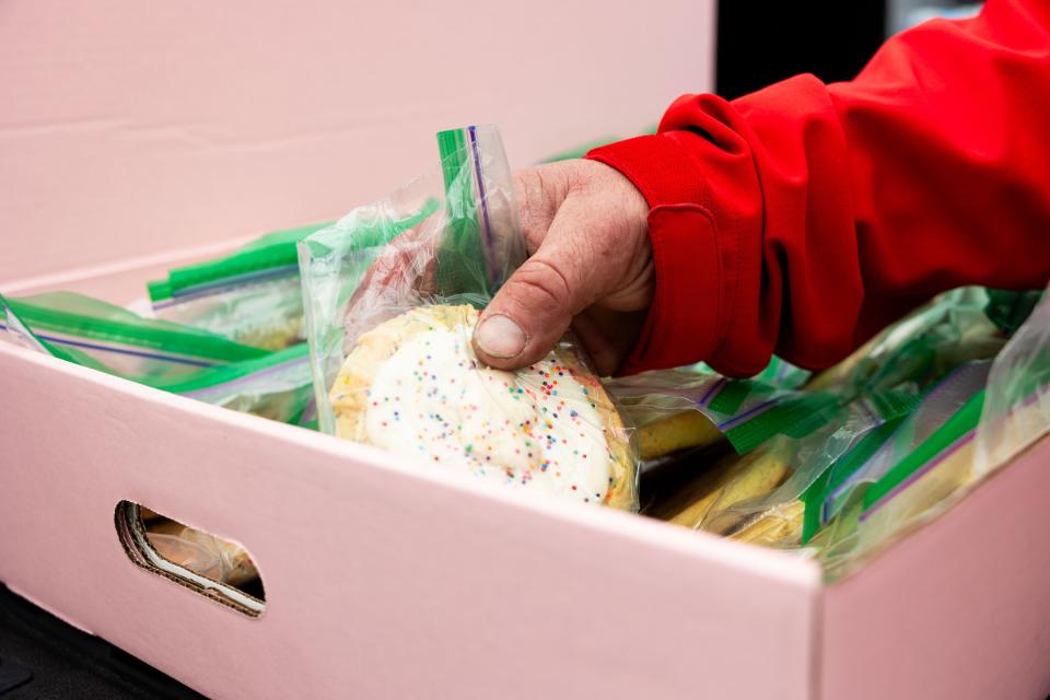 Matthew Andrus Hunter grabs a cookie from Be a Little Too Kind in Salt Lake City on Thursday, Feb. 1, 2024. Be a Little Too Kind is a nonprofit organization focused on assisting homeless people by providing a homemade meal every week and other essential life sustaining items. | Megan Nielsen, Deseret News