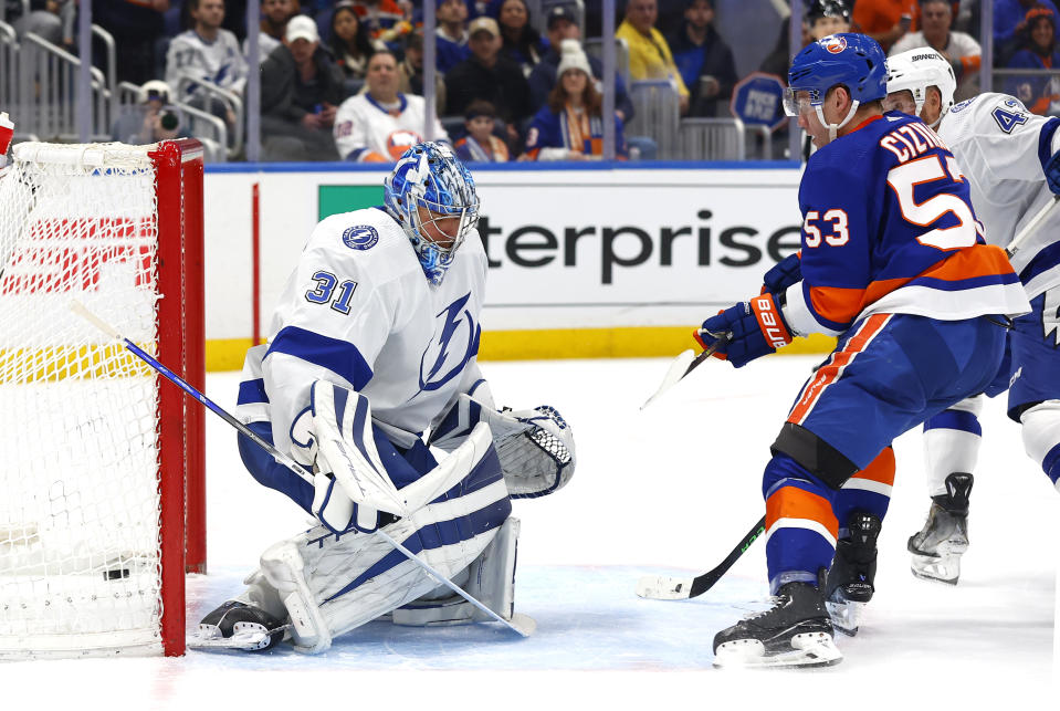 New York Islanders center Casey Cizikas (53) scores against Tampa Bay Lightning goaltender Jonas Johansson (31) during the second period of an NHL hockey game, Thursday, Feb. 8, 2024, in New York. (AP Photo/Noah K. Murray)