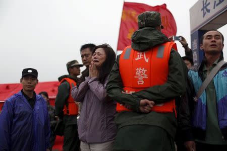 A relative of a missing passenger aboard the capsized ship Eastern Star cries on the banks of the Jianli section of Yangtze River in Hubei province, China, June 4, 2015. REUTERS/Aly Song