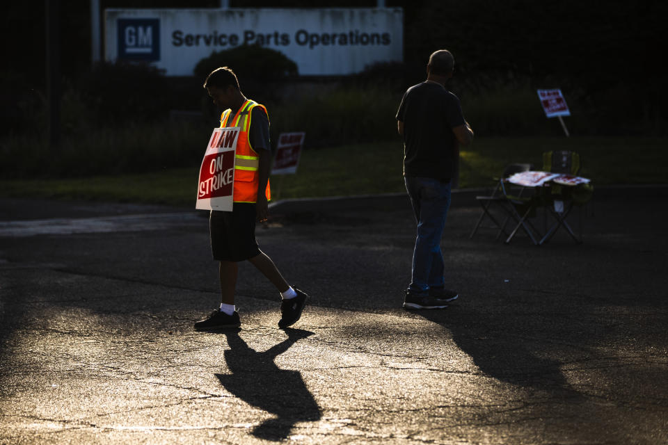 FILE - In this Tuesday, Sept. 17, 2019, file photo, workers demonstrate outside a General Motors facility in Langhorne, Pa. As the United Auto Workers’ strike against General Motors continues, consumers, the company and striking workers are starting to get pinched. (AP Photo/Matt Rourke, File)