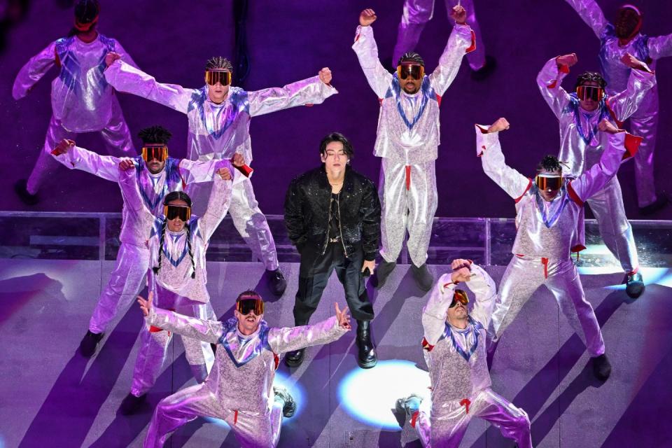 South Korean singer Jung Kook performs during the opening ceremony ahead of the Qatar 2022 World Cup Group A football match between Qatar and Ecuador at the Al-Bayt Stadium in Al Khor, north of Doha on November 20, 2022. (Photo by KIRILL KUDRYAVTSEV/AFP via Getty Images)