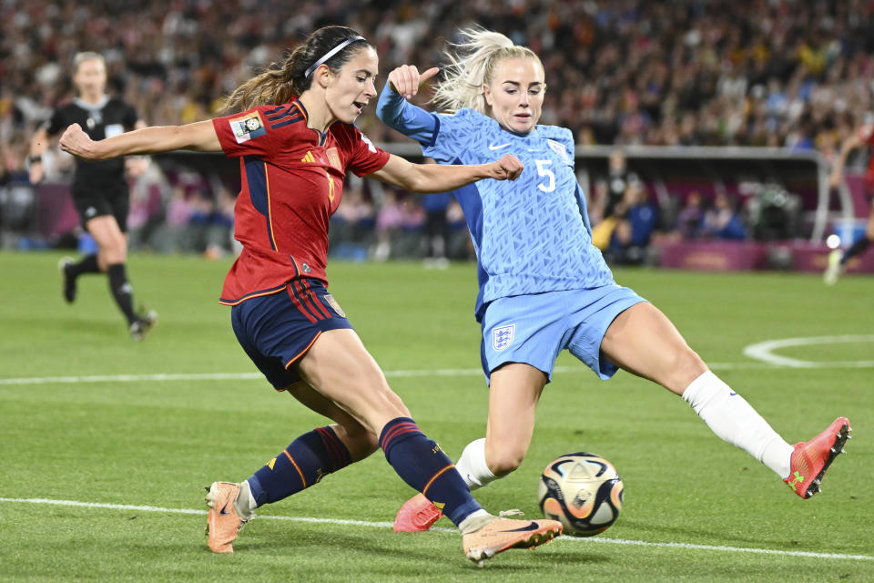 Spain's Aitana Bonmati, left, and England's Alex Greenwood, right, compete the ball during the Women's World Cup soccer final between Spain and England at Stadium Australia in Sydney, Australia, Sunday, Aug. 20, 2023. (AP Photo/Steve Markham)