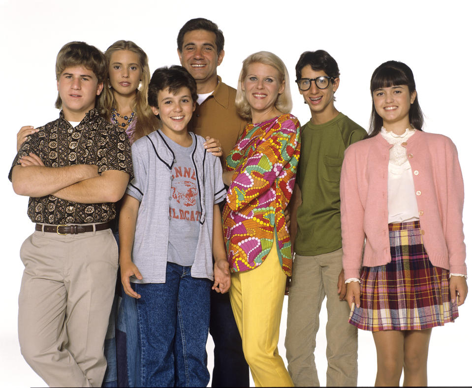 1990 cast photo of, from left, Jason Hervey, Olivia d’Abo, Fred Savage, Dan Lauria, Alley Mills, Josh Saviano, and Danica McKellar. (Photo: ABC Photo Archives/ABC via Getty Images)