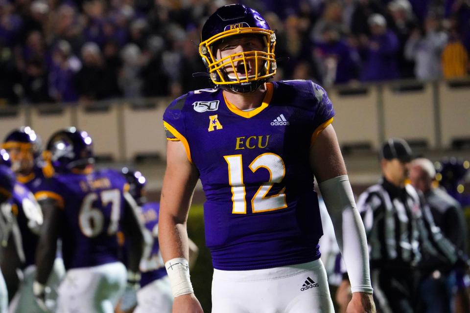 East Carolina Pirates quarterback Holton Ahlers (12) reacts after a touchdown against the Cincinnati Bearcats during their game at ECU during the 2019 season. Ahlers completed 32 of 52 passes for 535 yards, four touchdowns and an interception in a 46-43 loss.
