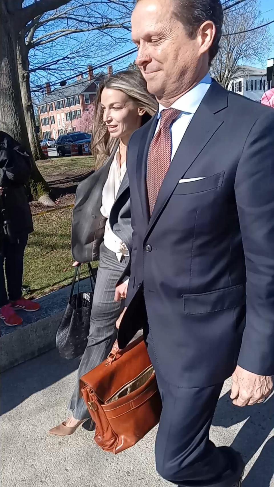 Karen Read and attorney Alan Jackson make their way to Norfolk Superior Court in Dedham.