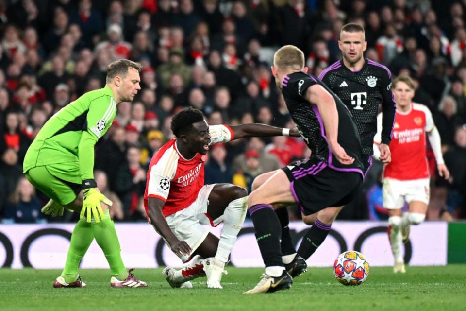 Saka goes down in the box after a collision with Neuer (Getty Images)